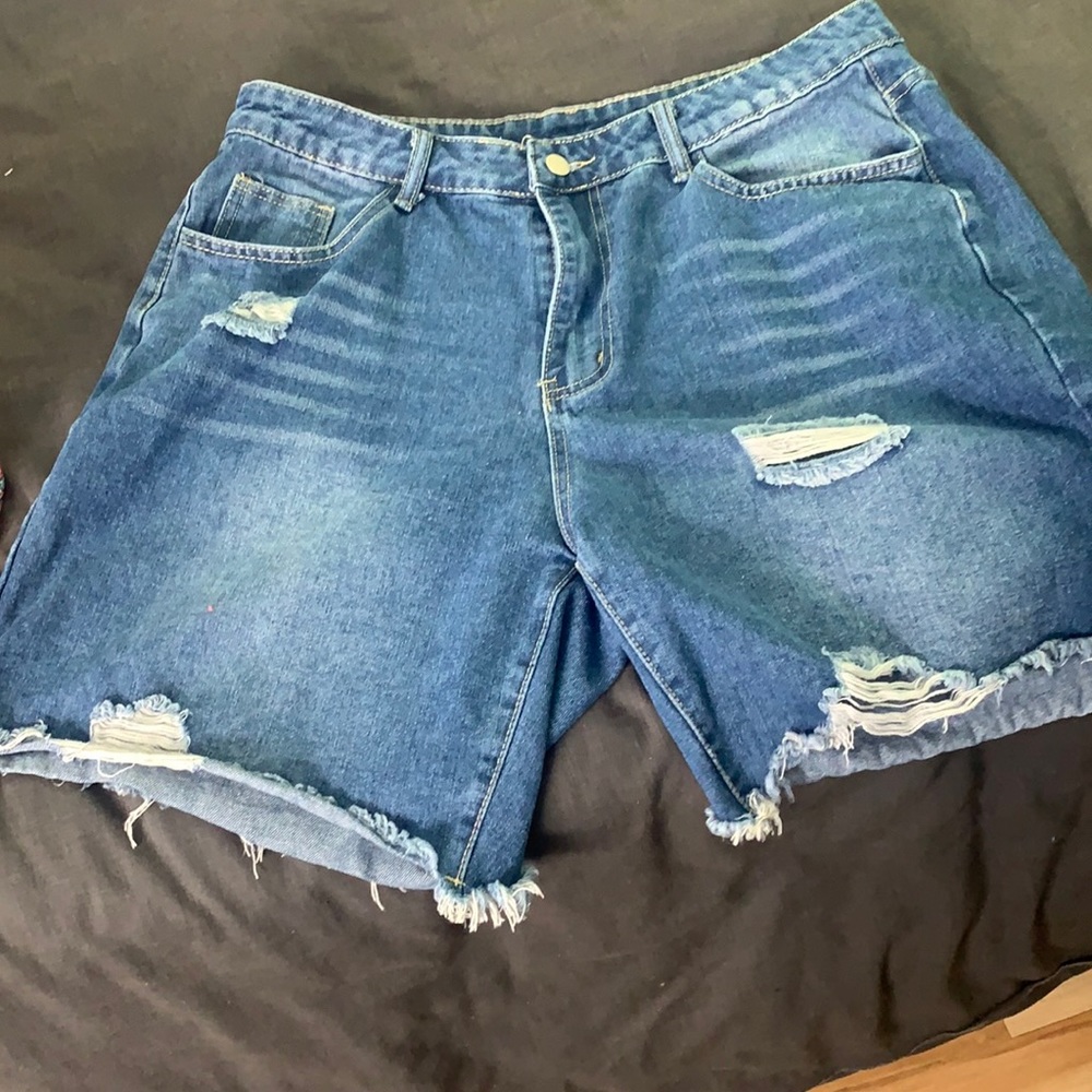 Above the knee medium dark wash distressed shorts